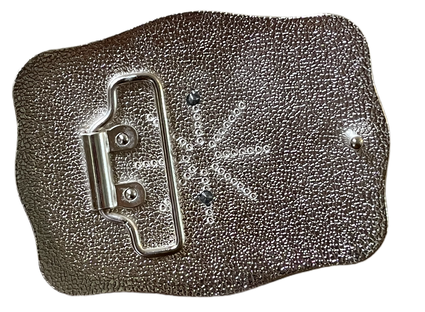 Metallic rectangular object with a textured surface on a black background