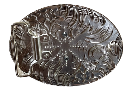 Decorative metal object with intricate patterns on a black background