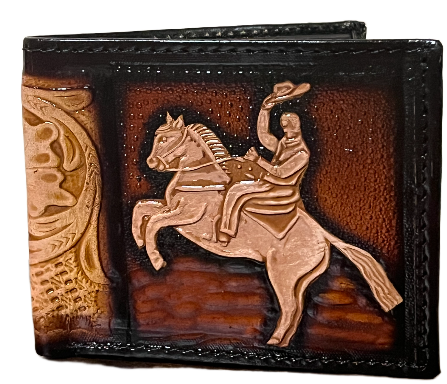 Decorative leather wallet with a horse and rider design on a brown background