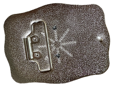 Metallic rectangular object with a textured surface on a black background