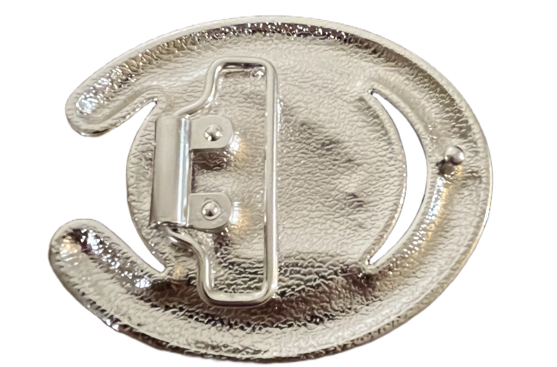 Metallic circular object with a central mechanism on a white background