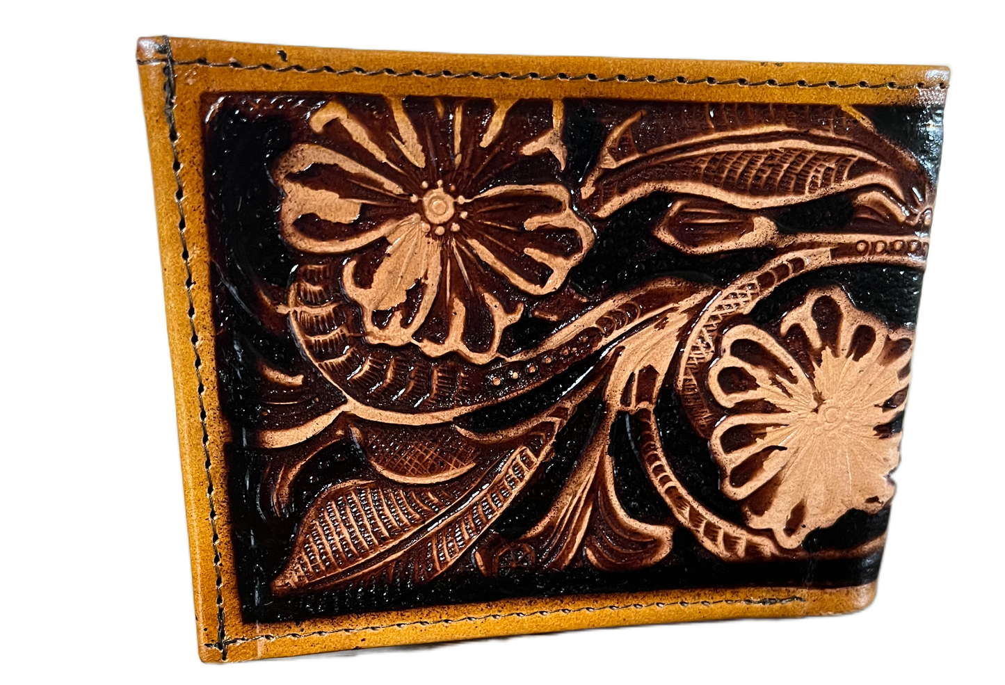Leather cardholder with floral embossing on a black background