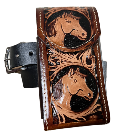 Brown leather wallet with embossed designs on a black background