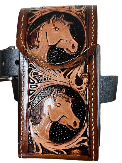 Brown leather wallet with horse embossing on a black background