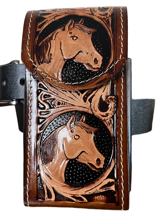 Brown leather wallet with horse embossing on a black background